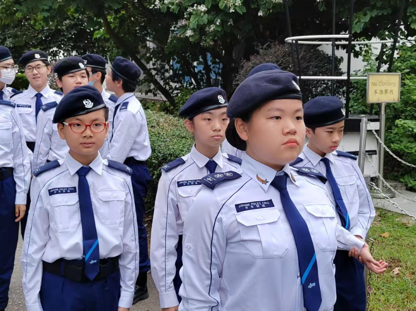 少年警讯金星得奖者徐骅美（前）参加在位于黄竹坑的香港警察学院举行的中式步操会操（2024年11月10日摄）。